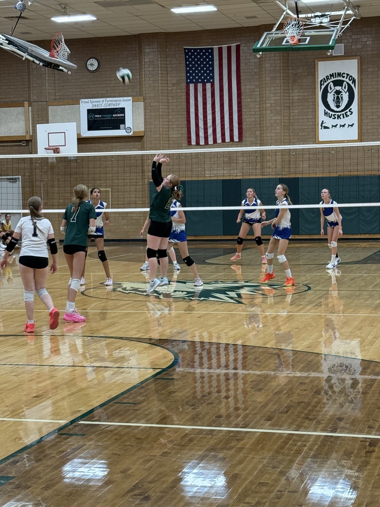 Athlete setting the ball for another player. 