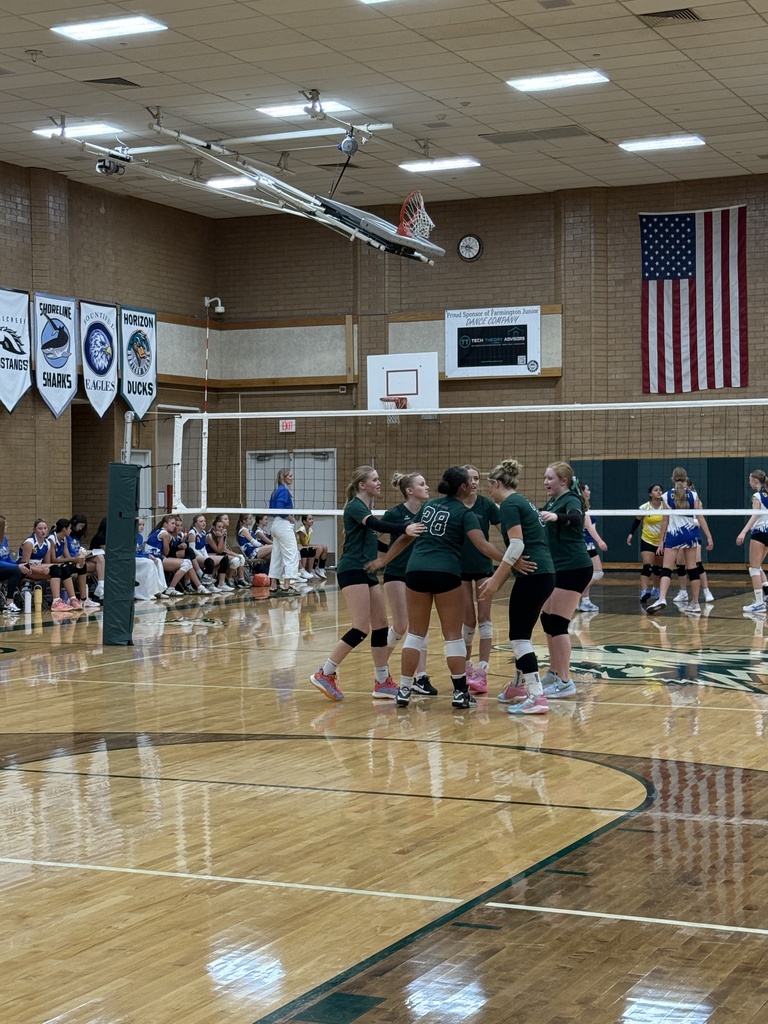 Team huddle after a point. 