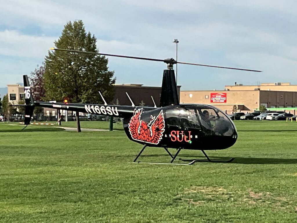 Students watch the SUU chopper land and meet the pilots to learn more about the program.