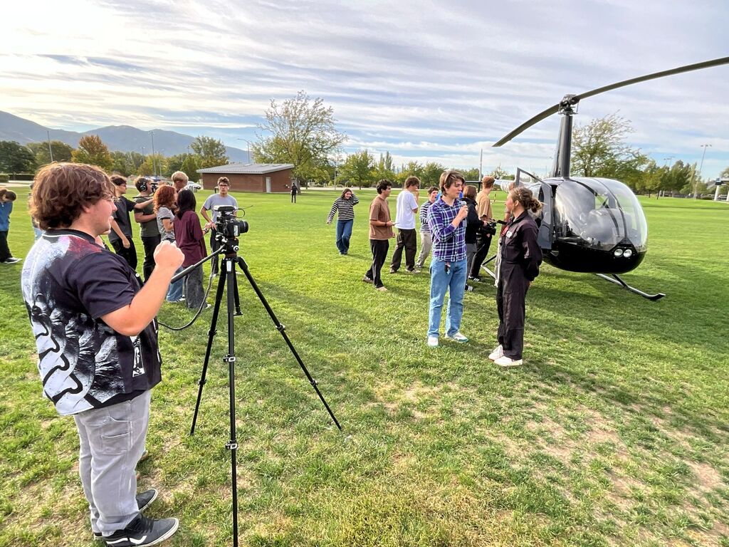 Students watch the SUU chopper land and meet the pilots to learn more about the program.
