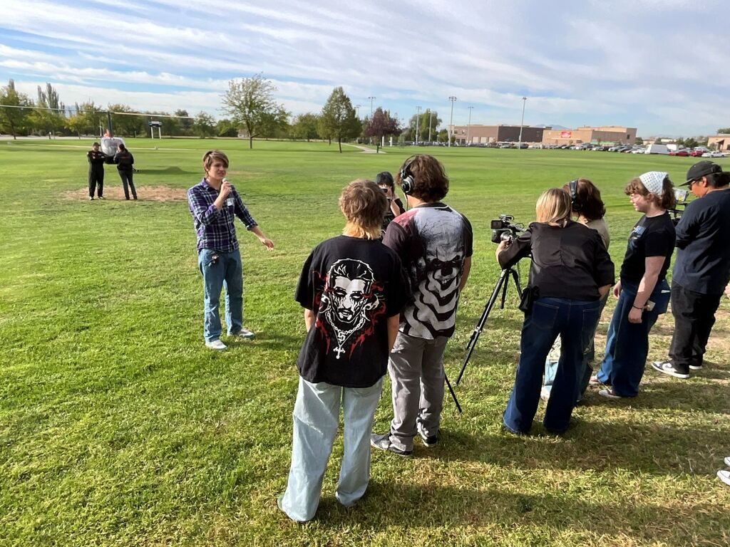 Students watch the SUU chopper land and meet the pilots to learn more about the program.