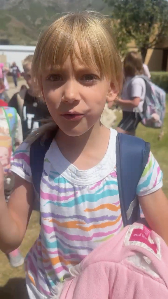 Student in front of school
