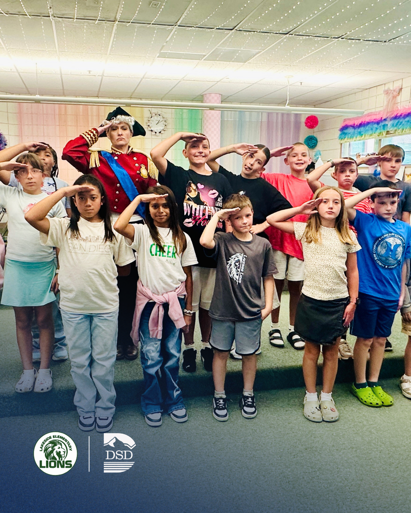 Students saluting to the camera.