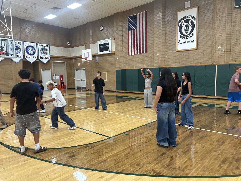 Latinos in Action Students playing basketball. 