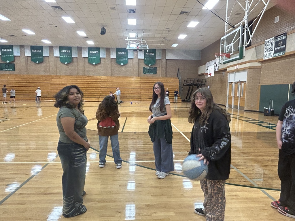 Group of students playing basketball. 