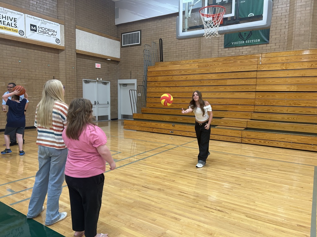 Students playing basketball. 