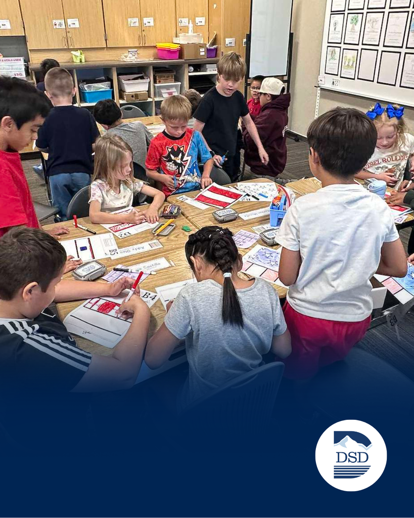 Students coloring flags in class
