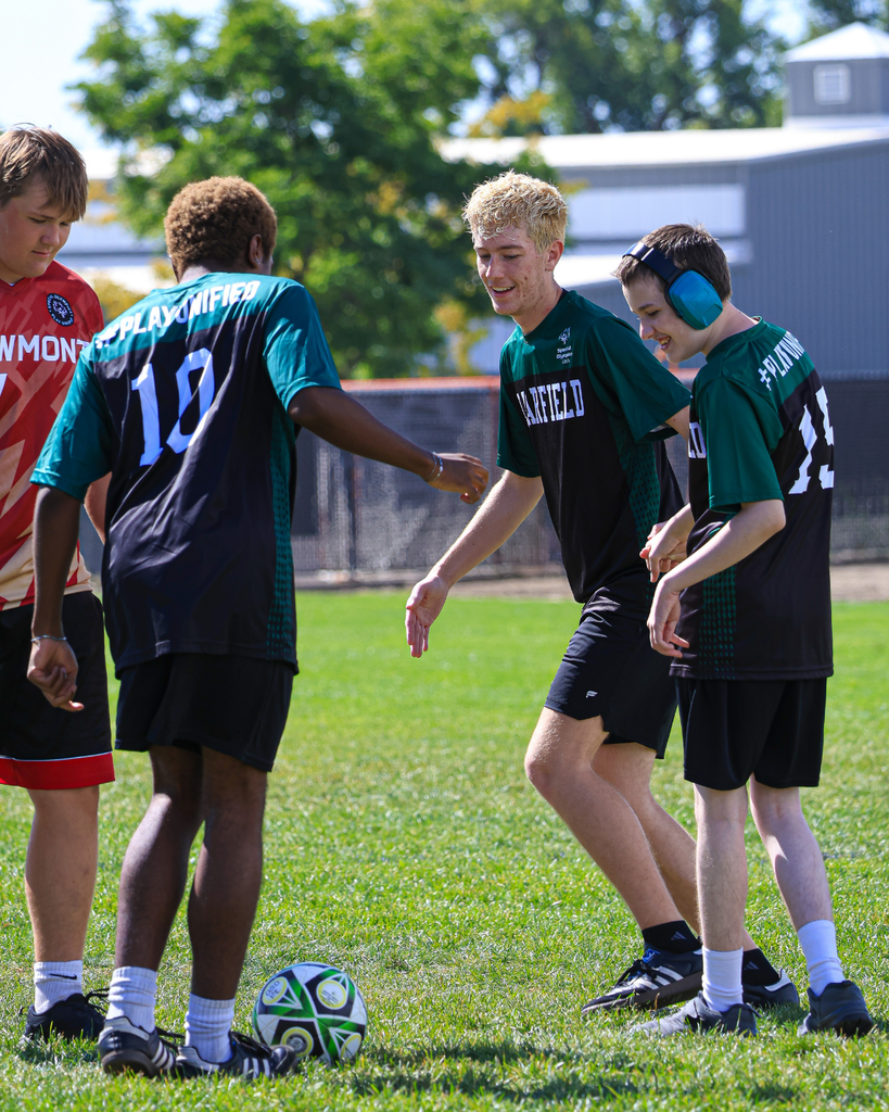 Students playing during a soccer game.
