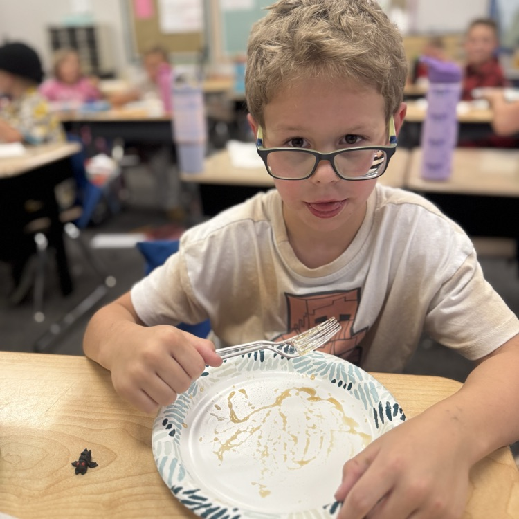 student with empty plate