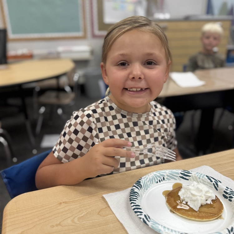 student with pancake