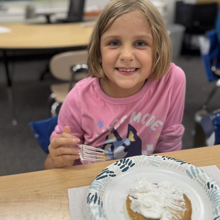 student with pancake