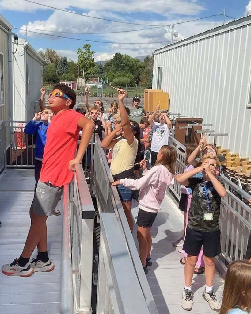 students view the solar eclipse