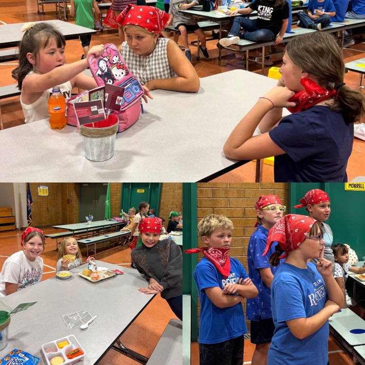 5th graders helping 1st graders during house lunch