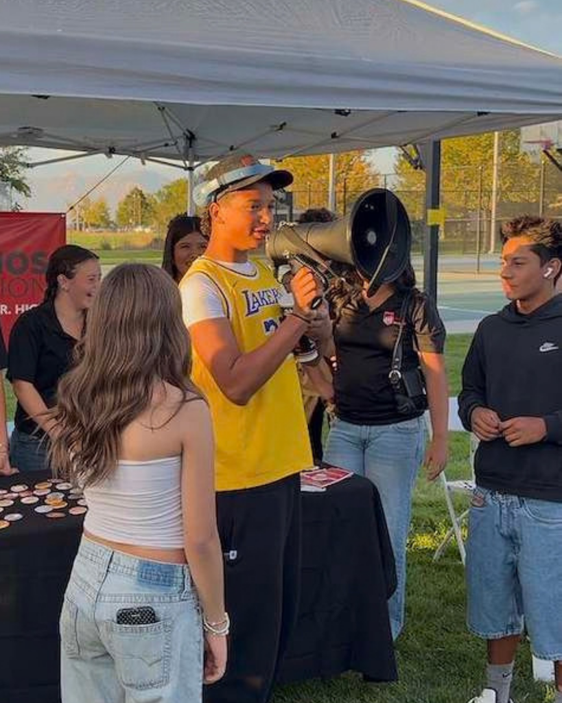 A student speaking into a megaphone