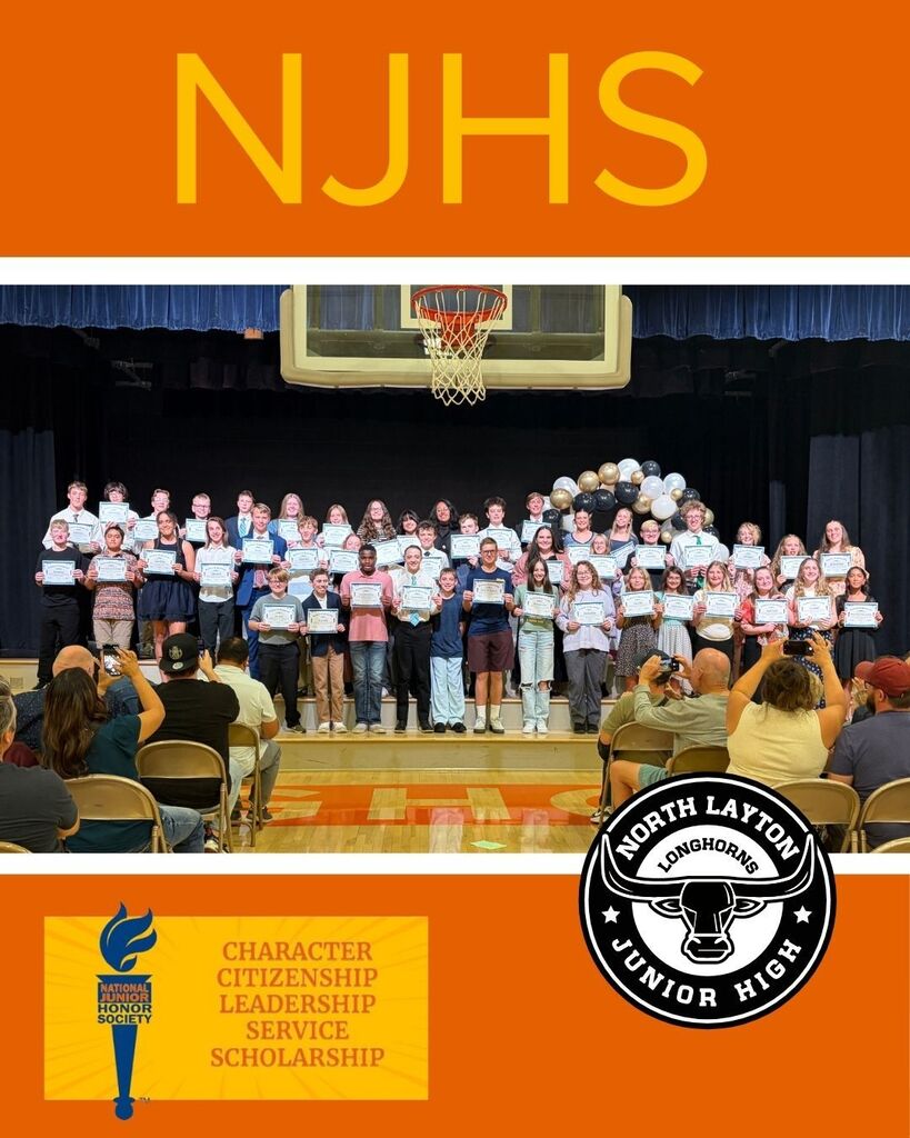 North Layton Jr High students standing on stage in the gym after being inducted into the National Jr. Honors Society
