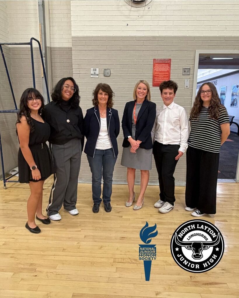 National Jr Honors Society students, Principal Erin Stumo and Layton Mayor Joy Petro standing in the gym during the induction ceremony
