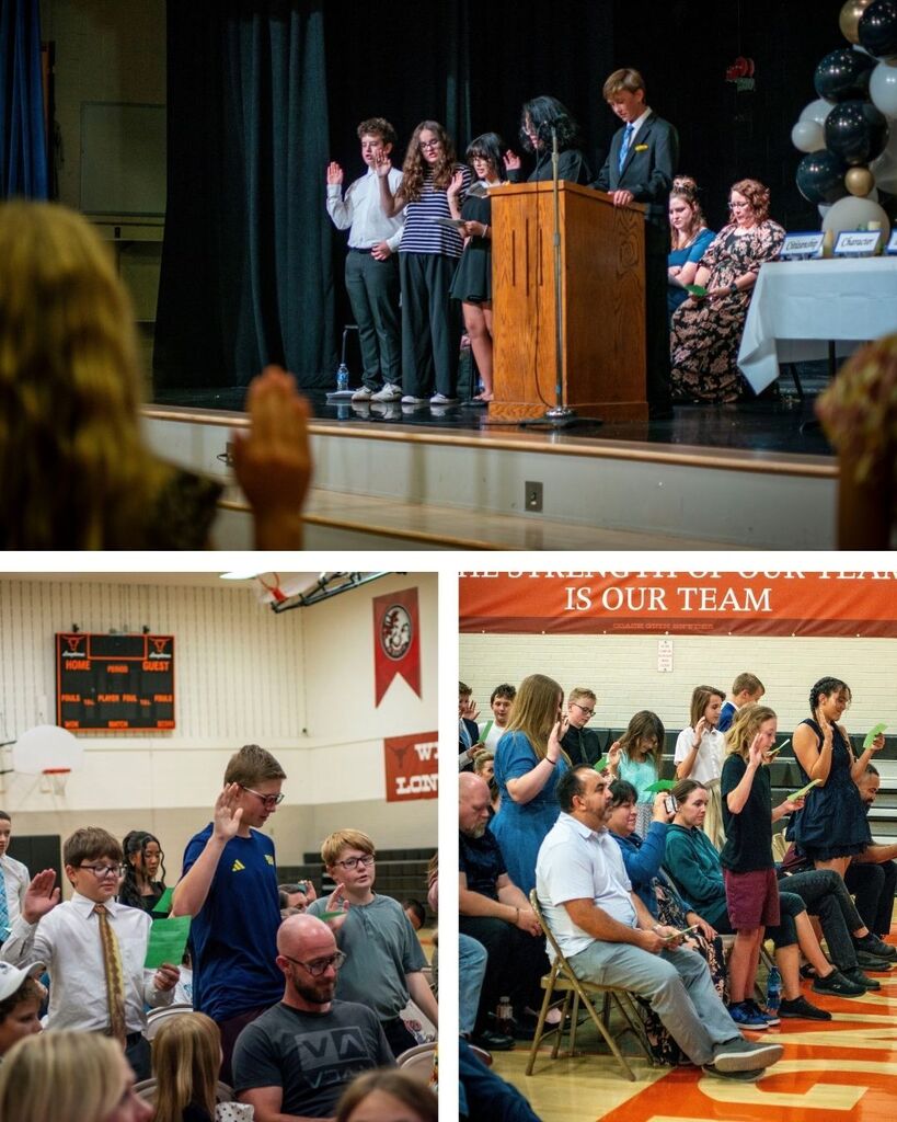 National Jr Honors Society students standing giving their pledge during the induction ceremony