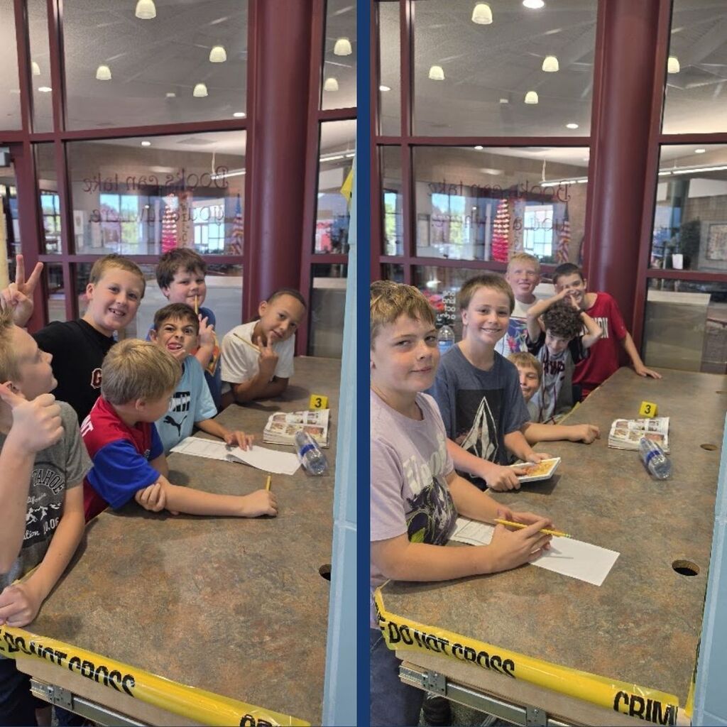 Students investigate a broken book surrounded by Crime Scene yellow tape.