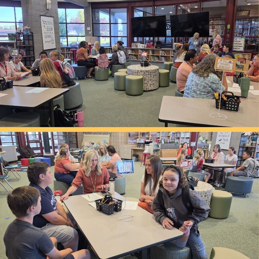 Students gather around a table to discuss House Members of the Month