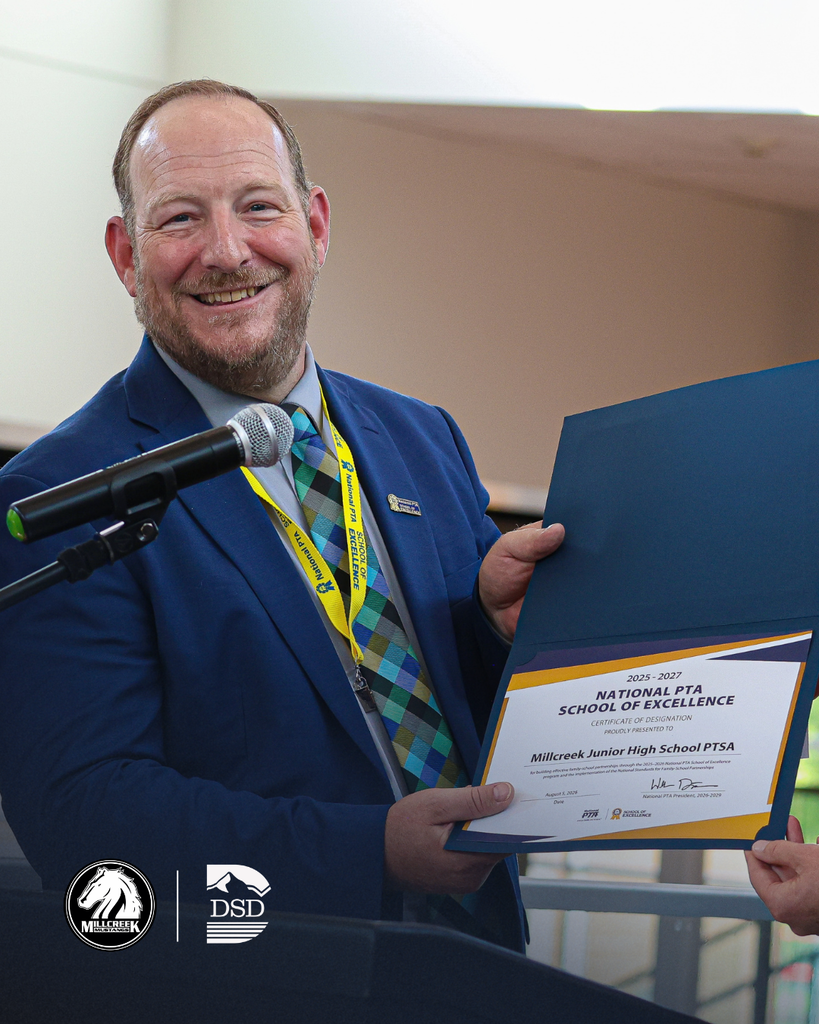 Principal Hansen holding a certificate for 2025-2027 National PTA School of Excellence presented to Millcreek Junior High School PTSA