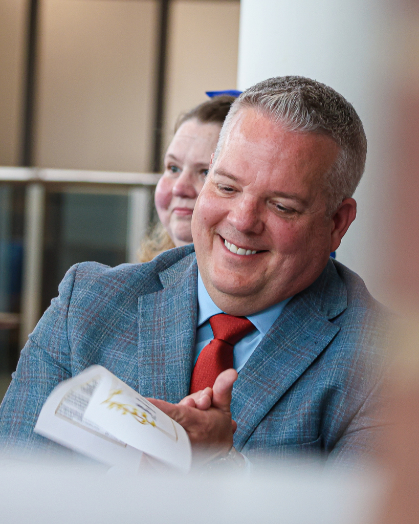 Davis School District Superintendent Dr. Dan Linford clapping and smiling. 