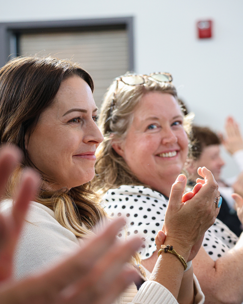 Davis School District Board members clapping. 