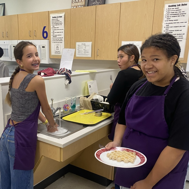 students doing dishes