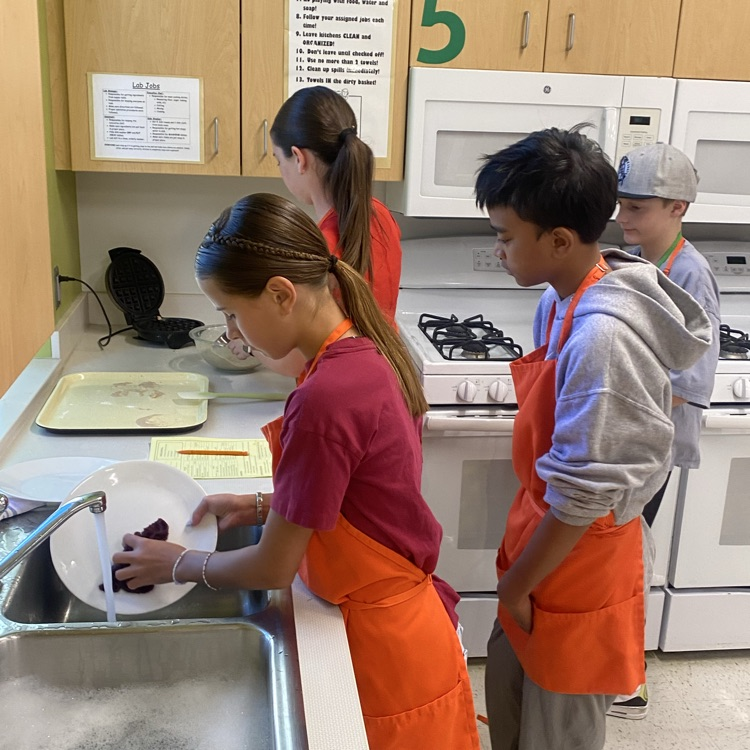 students doing dishes