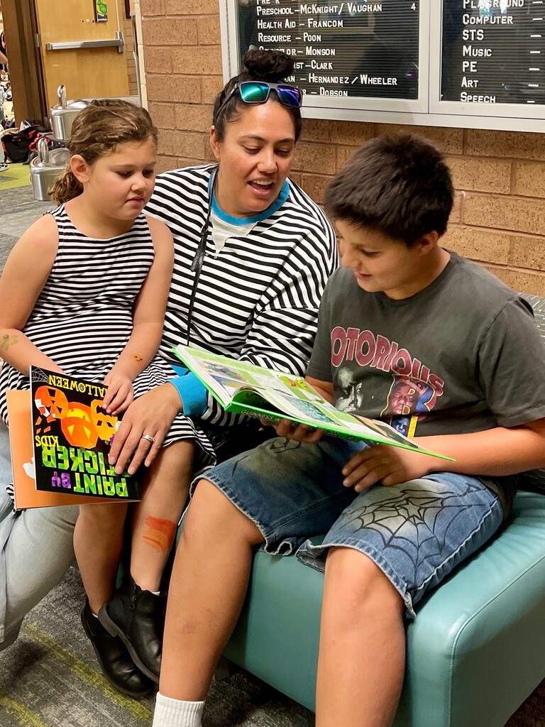 Picture of family reading