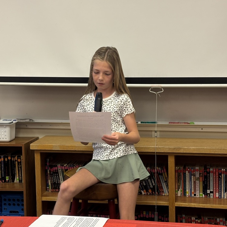 student reading her writing