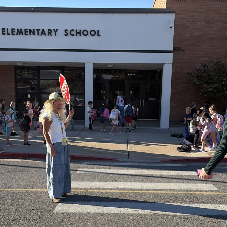 crossing guard dressed as Dolly Parton 