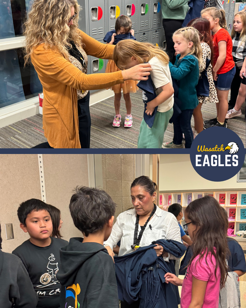 Photo collage showing the distribution of Wasatch Eagles spirit shirts to students at Wasatch Elementary. The top photo shows students waiting in line near a row of lockers while a staff member helps place a navy blue Wasatch Eagles T-shirt over a student's head. Other students stand nearby waiting to receive their shirts. The bottom photo shows another staff member holding a stack of navy blue Wasatch Eagles T-shirts while students gather around to receive theirs. Classroom cubbies and school hallway features are visible in the background. The Wasatch Eagles logo appears on the right side of the collage. The images highlight students receiving school spirit shirts and preparing to participate in a Wasatch Eagles spirit day.
