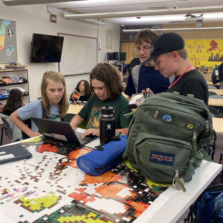 students playing games and sticker by number