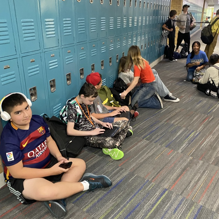 students socializing in the hall