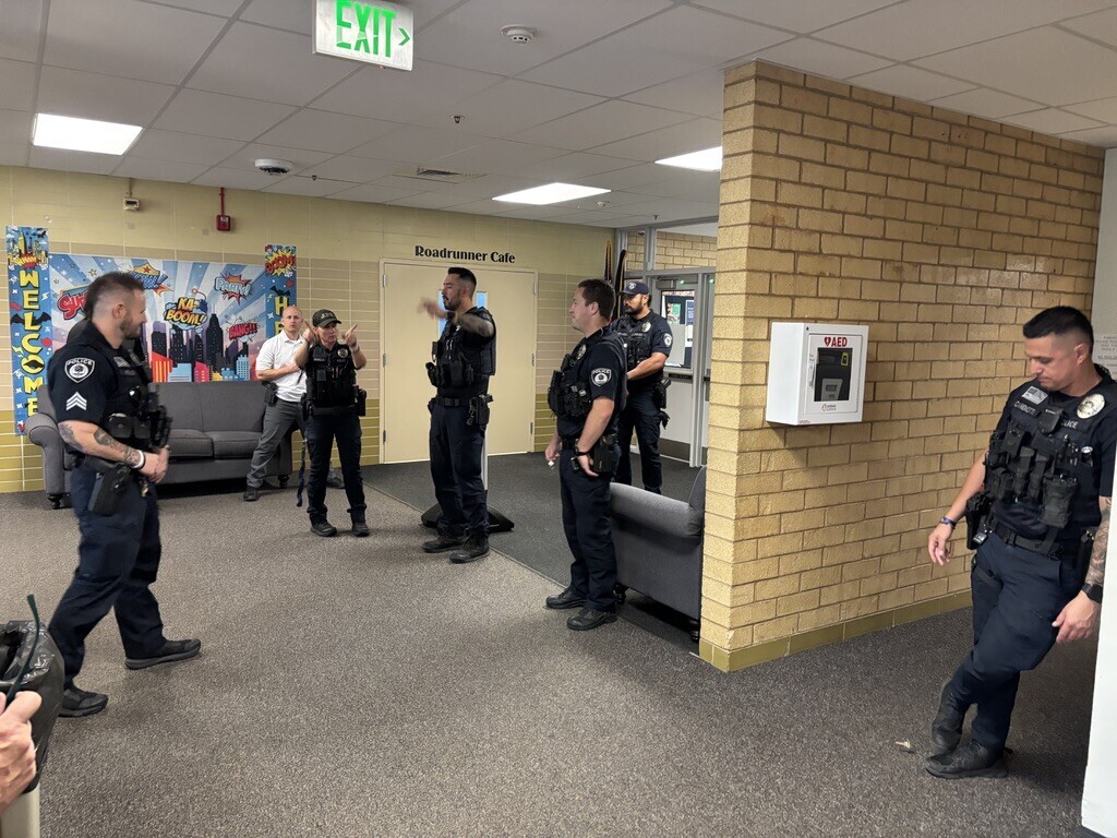 A photo of Farmington City Police Officers helping at the school with our lockdown drill