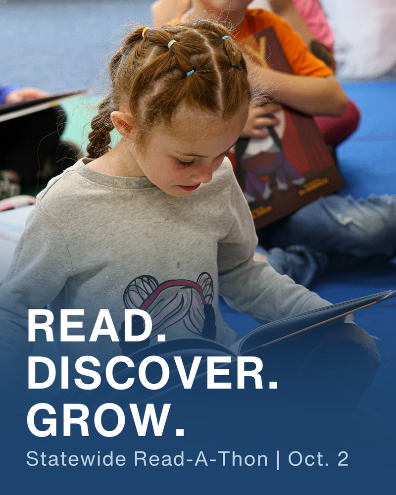 A student sits and looks down at an open picture book. Text reads, “Read. Discover. Grow. Statewide Read-A-Thon | Oct. 2.”