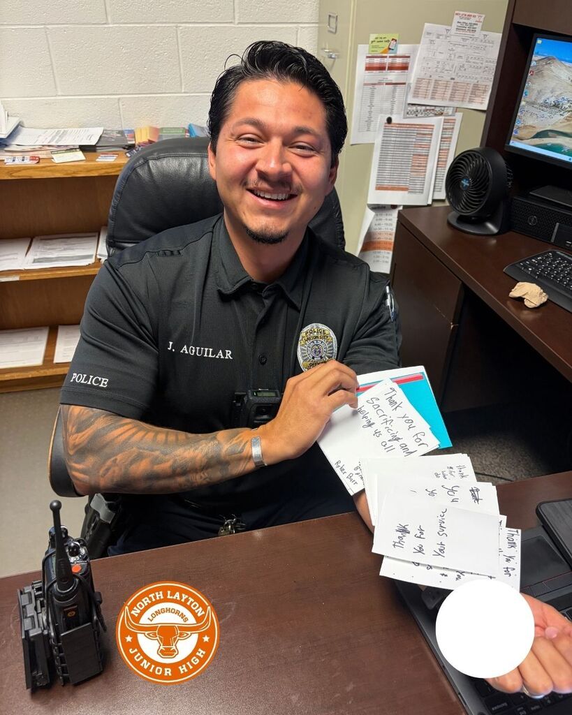 A school officer holds thank you cards that students wrote to first responders on 9/11
