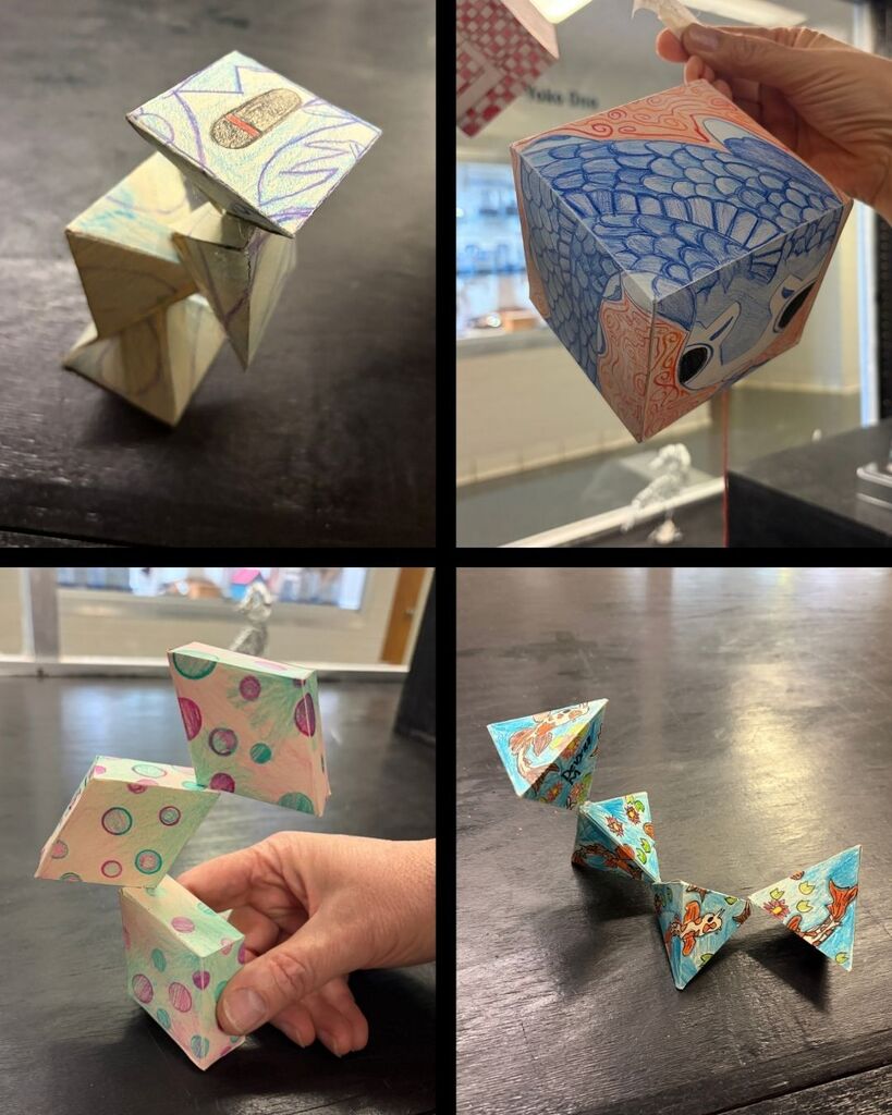 Different 3D student art. Boxes that are colored and different shapes