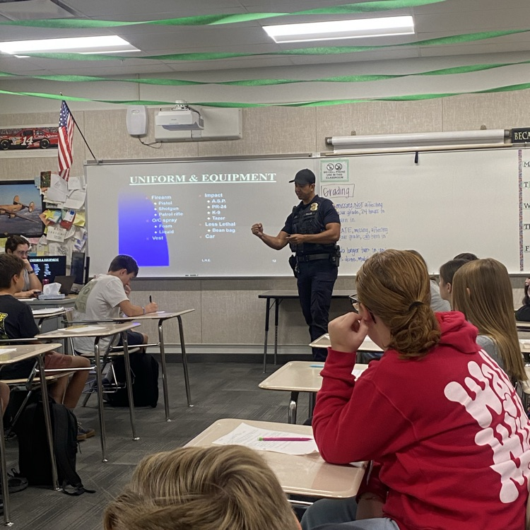 officer teaching students