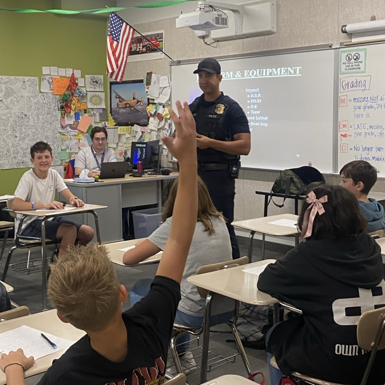 officer teaching students