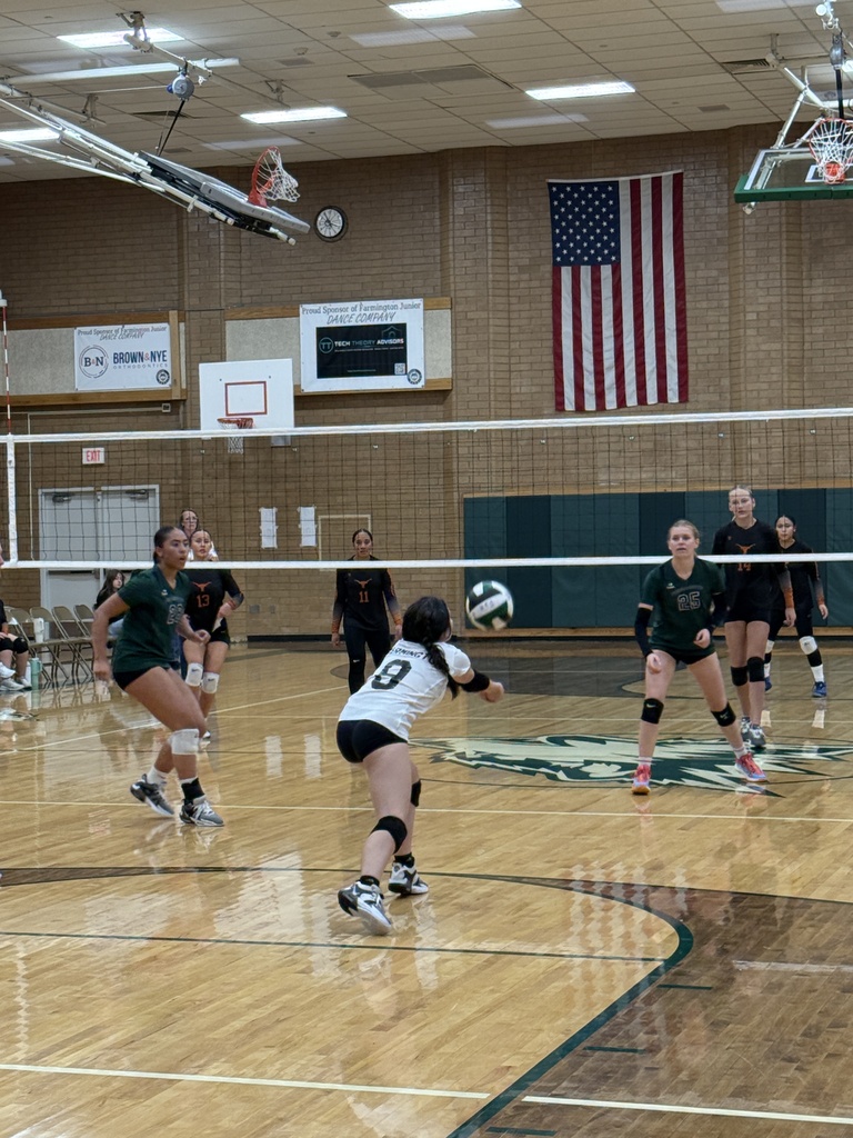 Student returning the serve. 