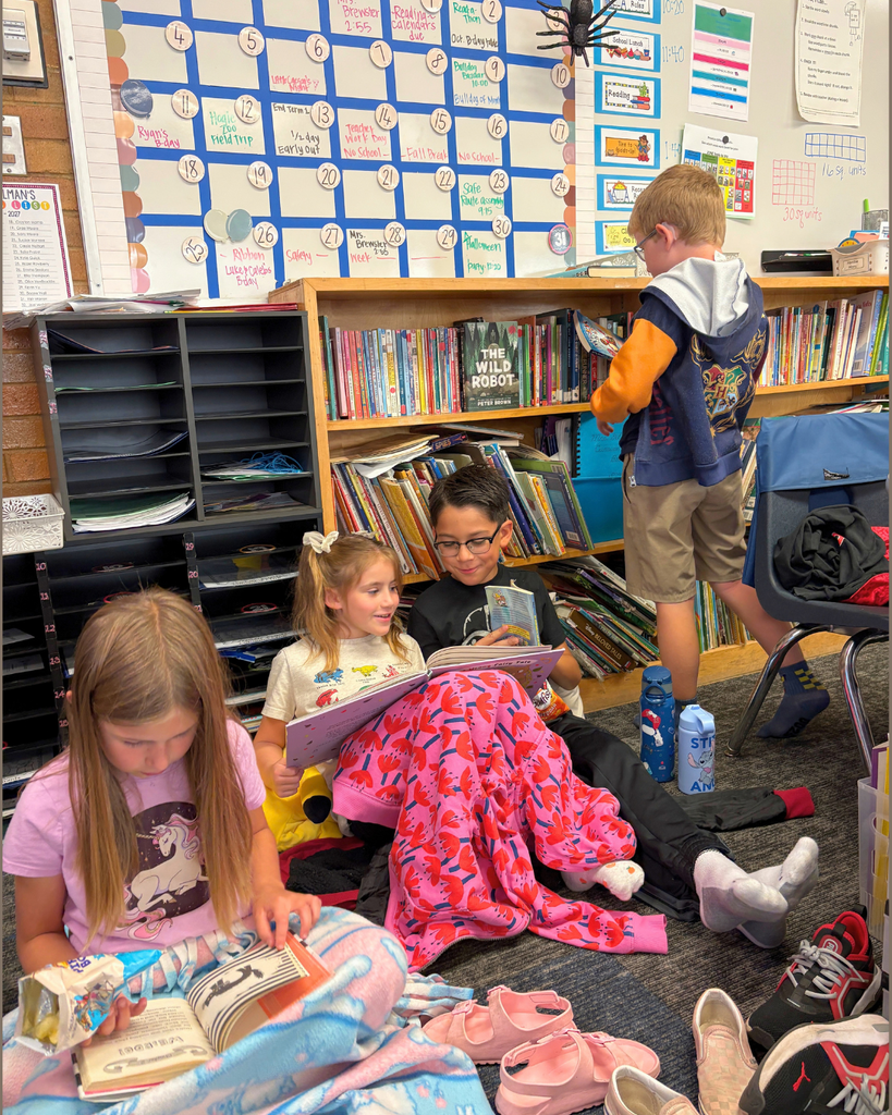 a group of students read ad look for a book