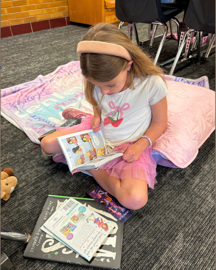 a student enjoys the read-a-thon