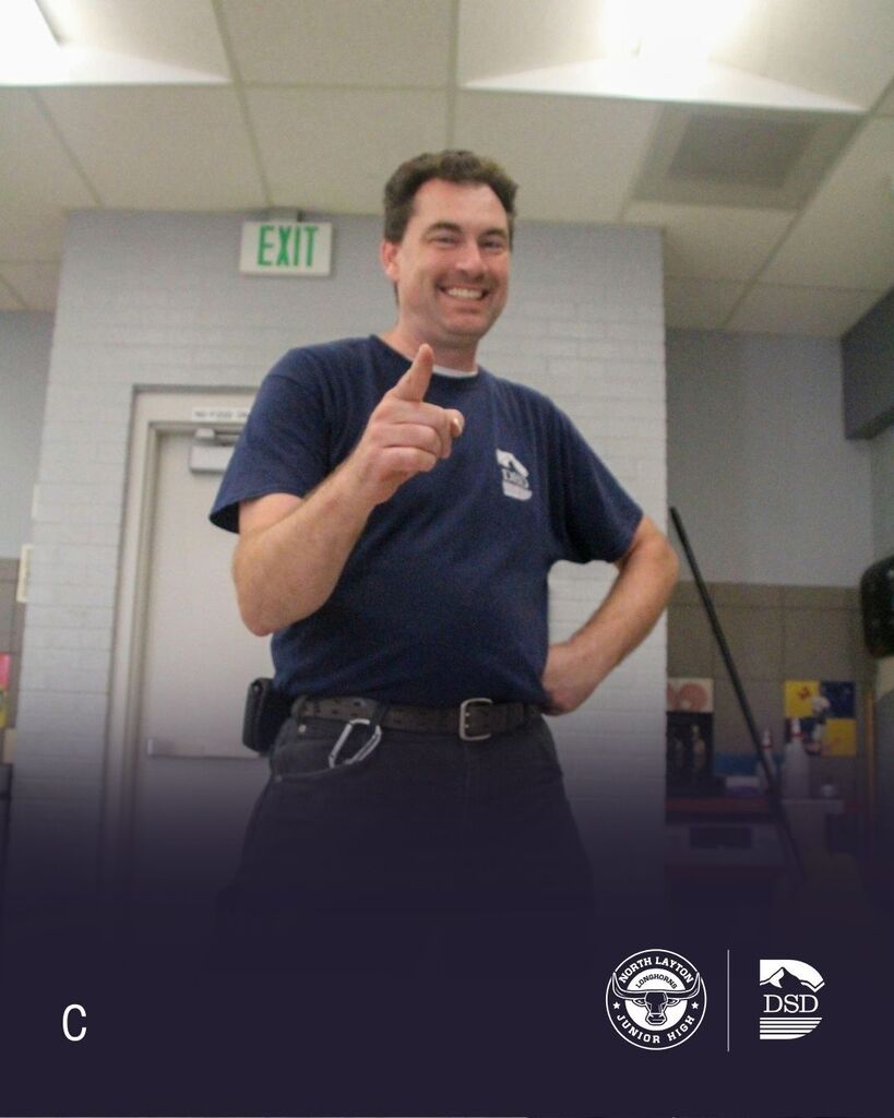 our head custodian smiling in the cafeteria