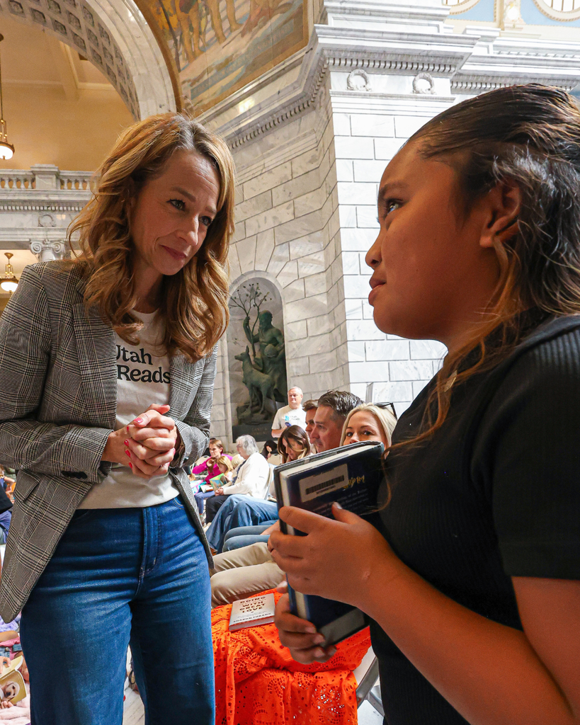 A Davis School District student talks with First Lady Abby Cox at the Utah Reads Read-A-Thon at the Utah State Capitol. 