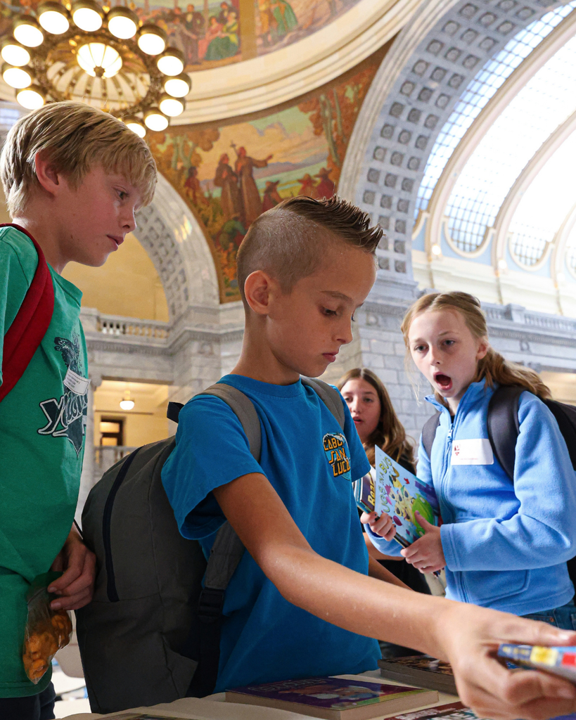 Davis School District students looking at books  at the Utah Reads Read-A-Thon at the Utah State Capitol. 
