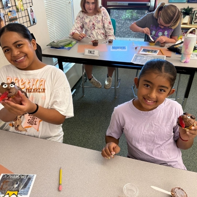Students show off their bear cupcakes.