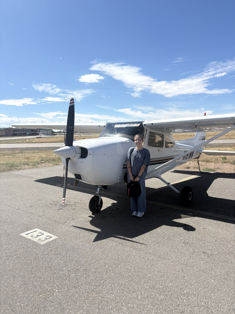 Megan taking a picture after passing her check ride in a Cessna 172
