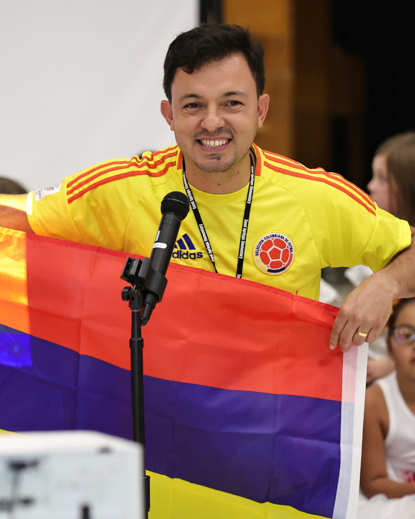 A teacher celebrates their Columbian culture with their school.