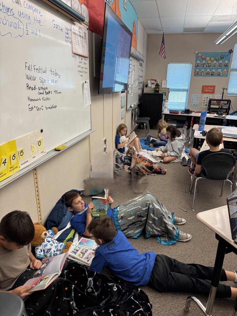 students reading books in classroom